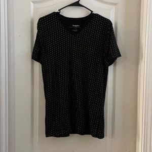 Black T-shirt with patterns on it.